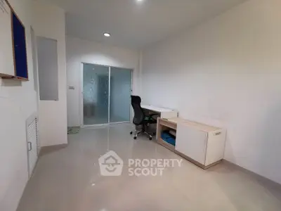 Minimalist study room with sleek desk and ergonomic chair, perfect for productivity.