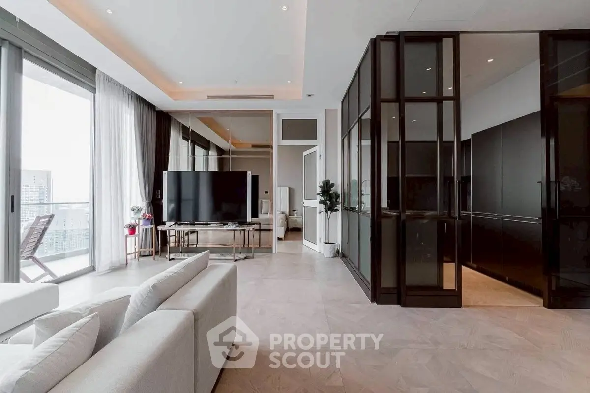 Spacious modern living room with large windows and sleek design