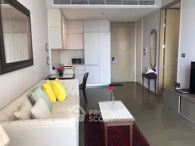 Chic modern living room with open kitchen, stylish decor, and cozy seating area in a contemporary apartment.