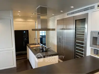 Luxurious modern kitchen with sleek appliances and island in upscale home