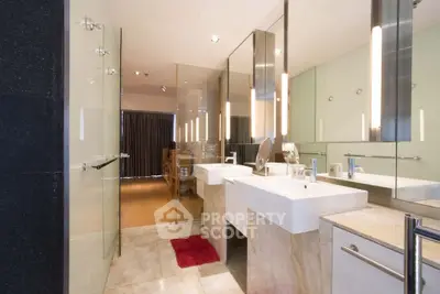 Luxurious modern bathroom with dual sinks and elegant lighting