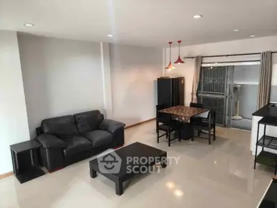 Spacious living room with modern furniture and open layout