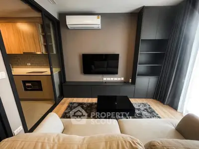 Modern living room with sleek design and open kitchen layout