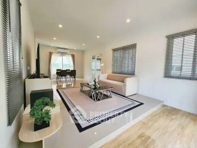 Spacious modern living room with elegant decor and natural light