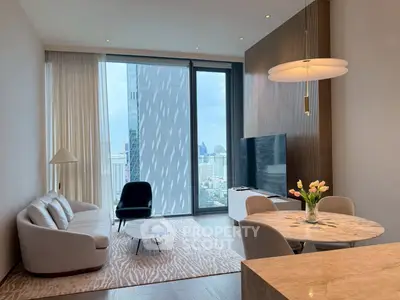Luxurious modern living room with stunning city view, elegant furniture, and chic decor in high-rise apartment.