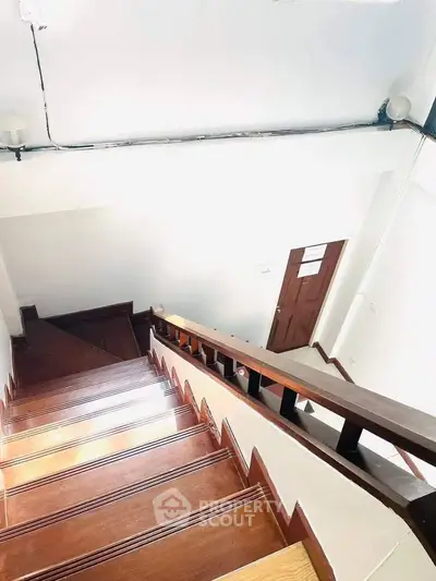 Bright wooden staircase in modern building with sleek design