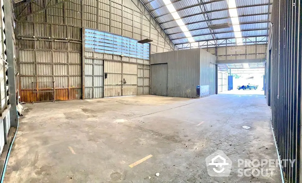 Spacious industrial warehouse with high ceilings and ample natural light