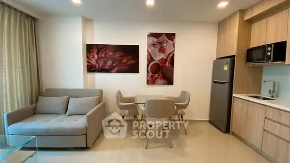 Modern living room with cozy sofa and dining area in stylish apartment