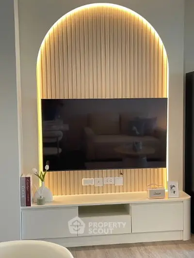 Modern living room with stylish TV setup and ambient lighting