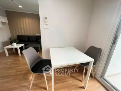 Modern living room with dining area and stylish furniture in a cozy apartment.