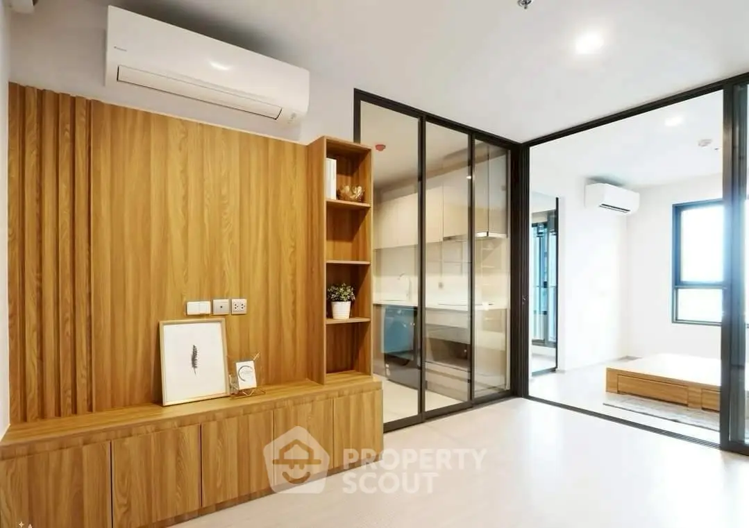 Modern apartment interior with wooden accents and glass partitions