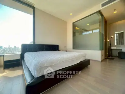 Luxurious bedroom with city view and modern design in high-rise apartment