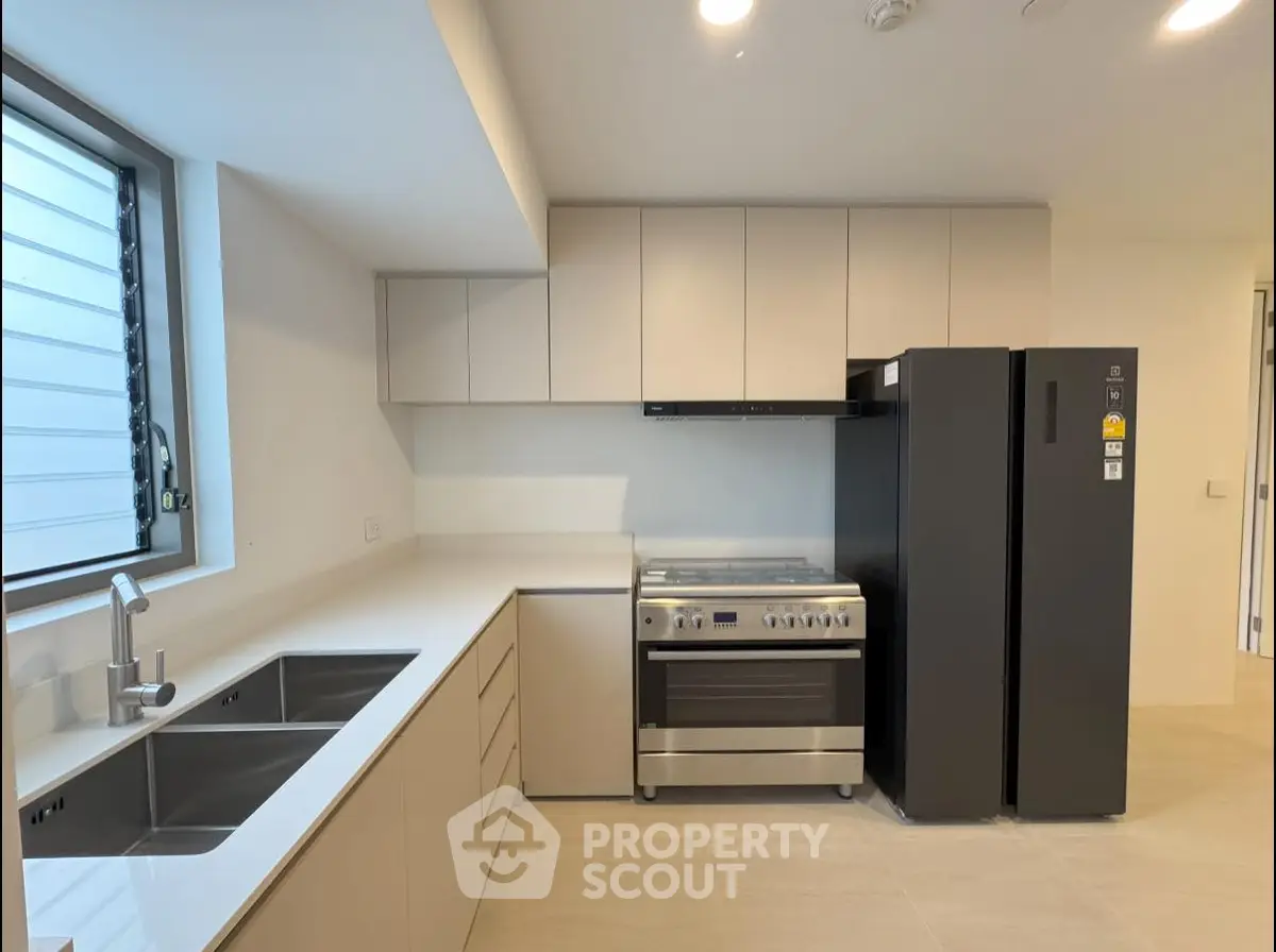Modern kitchen with sleek cabinetry and stainless steel appliances