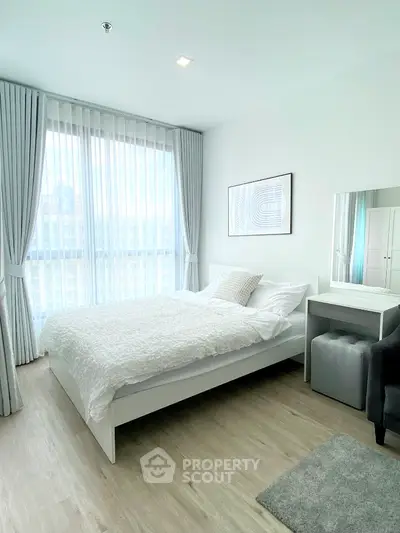 Bright modern bedroom with large windows and elegant decor