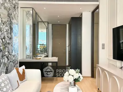 Modern living room with elegant decor and open layout, featuring a stylish sofa and decorative elements.