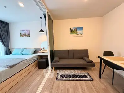 Modern studio apartment with cozy living area and stylish decor