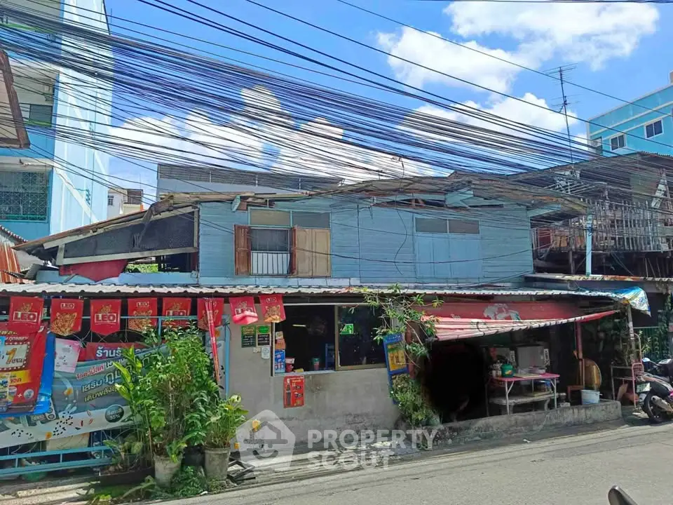 Charming rustic building with street view, perfect for small business or renovation project.