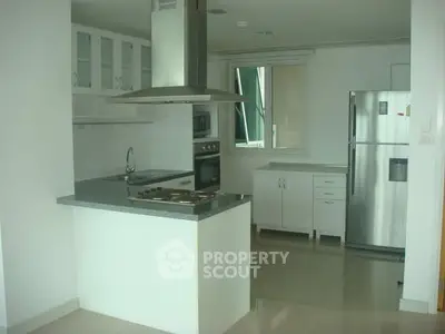 Modern kitchen with sleek appliances and open layout design