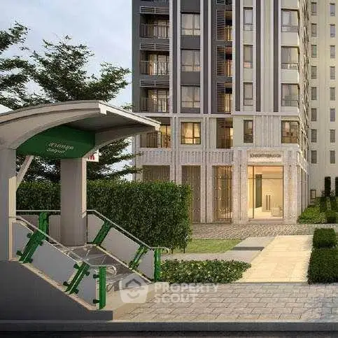 Modern apartment building entrance with lush greenery and pathway