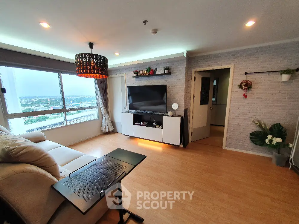 Modern living room with large window and stylish decor
