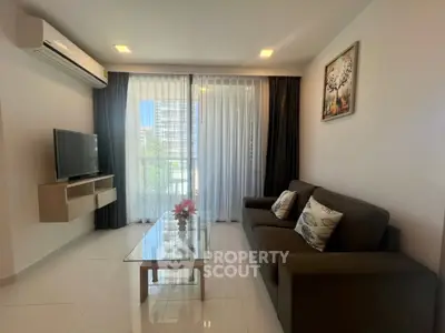 Modern living room with sleek design and large window view