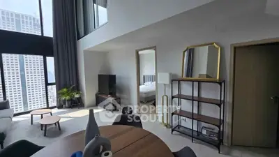 Modern living room with high ceilings and city view, featuring stylish furniture and open layout.