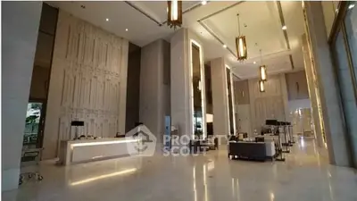 Luxurious hotel lobby with high ceilings and elegant lighting fixtures