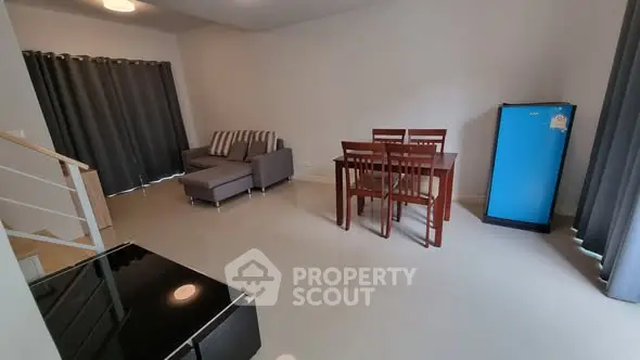 Spacious living room with modern furniture and natural light