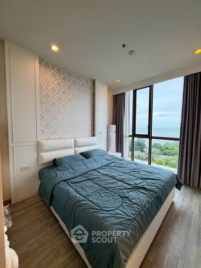 Luxurious bedroom with stunning ocean view and elegant decor