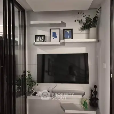 Modern living room with sleek TV setup and stylish decor