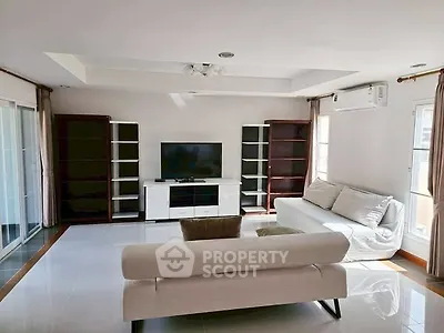 Spacious living room with modern furniture and natural light
