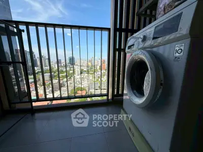High-rise balcony with washing machine and stunning city view