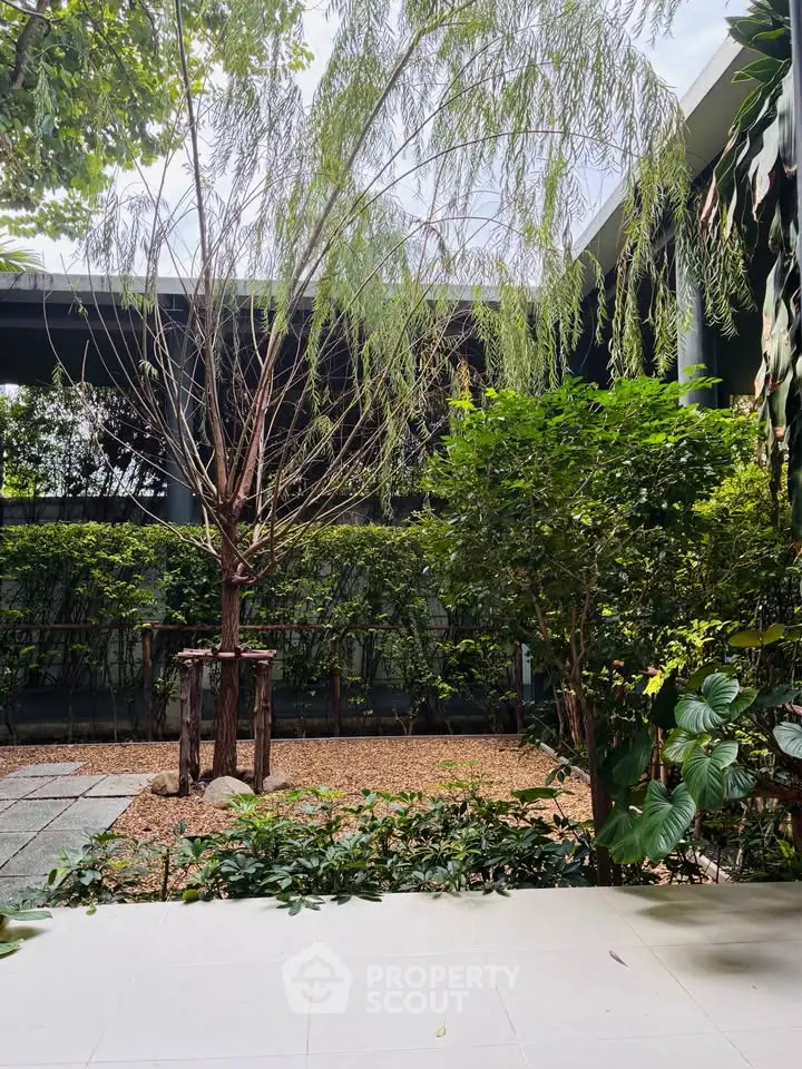 Serene garden view with lush greenery and a tranquil atmosphere, perfect for relaxation and outdoor enjoyment.