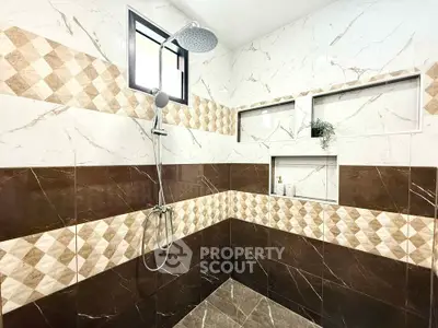 Luxurious bathroom with elegant marble tiles and modern shower design