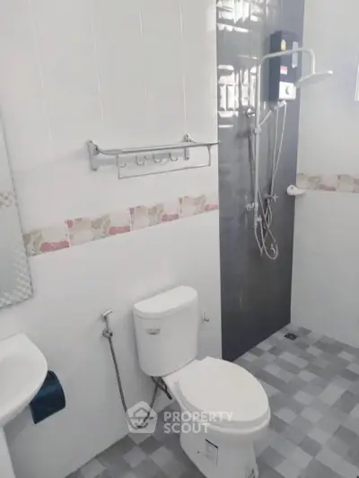 Modern bathroom with shower and toilet in sleek design