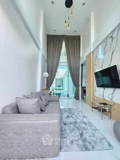 Luxurious modern living room with high ceilings and elegant decor
