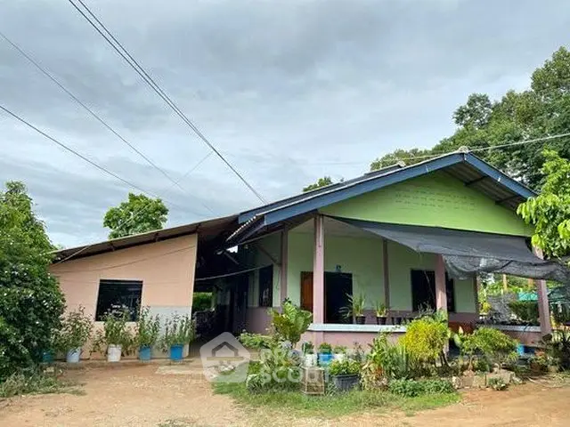 Charming single-story home with lush garden and spacious outdoor area, perfect for family living.