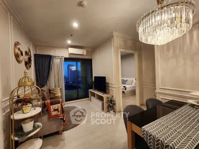 Luxurious living room with elegant decor and city view balcony access