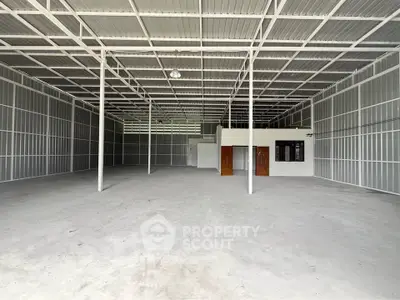 Spacious industrial warehouse with high ceilings and ample storage space.