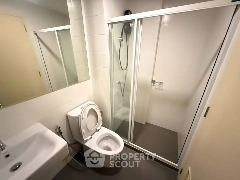 Modern bathroom with glass shower and sleek fixtures
