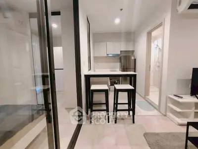 Modern compact apartment with open kitchen and stylish bar seating