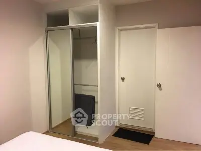 Modern bedroom with built-in sliding wardrobe and minimalist design