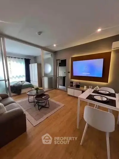 Modern living room with open layout, stylish decor, and cozy ambiance in a contemporary apartment.