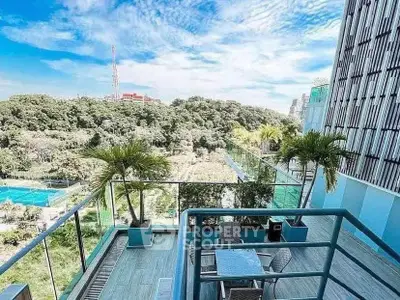 Stunning balcony view with lush greenery and modern cityscape, perfect for relaxation and entertainment.