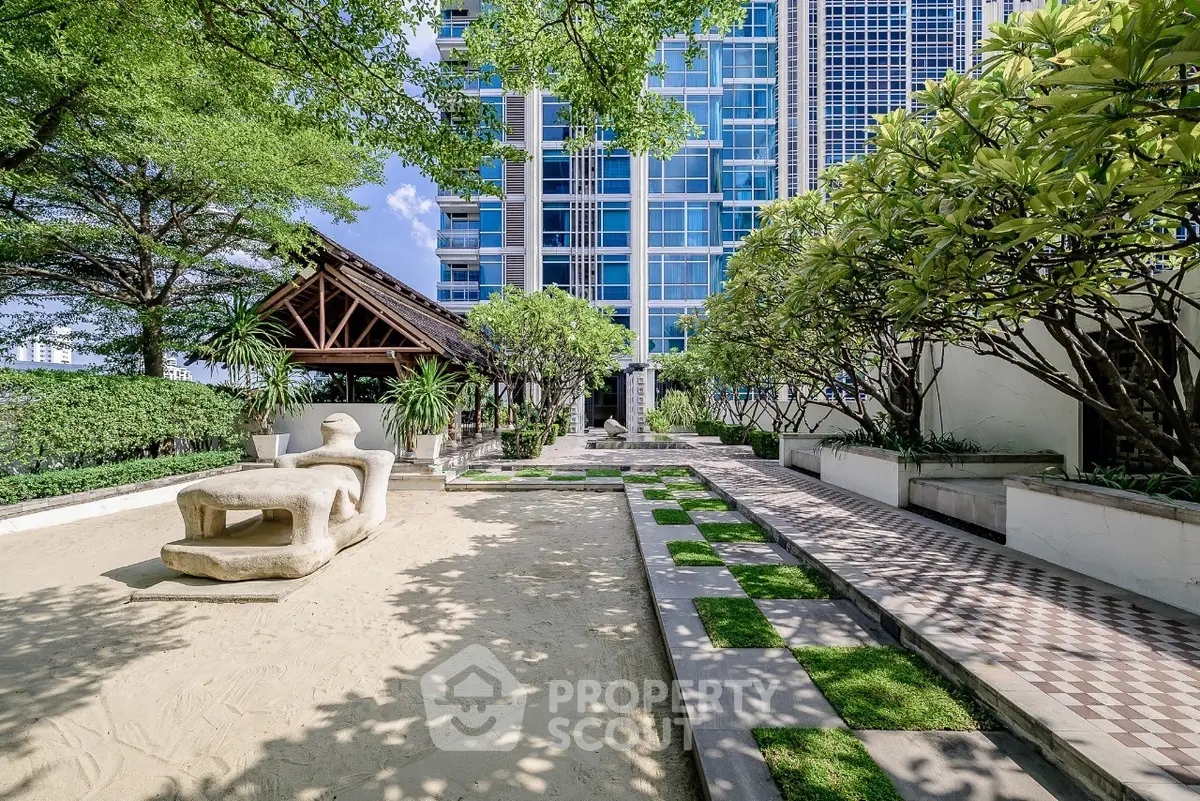 Luxurious garden area with modern architecture and lush greenery
