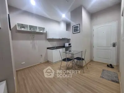 Modern compact kitchen with dining area in a cozy apartment