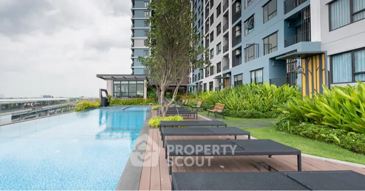 Luxurious apartment complex with stunning poolside and lush greenery, perfect for relaxation and leisure.