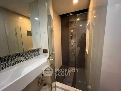 Modern bathroom with sleek shower and stylish sink design