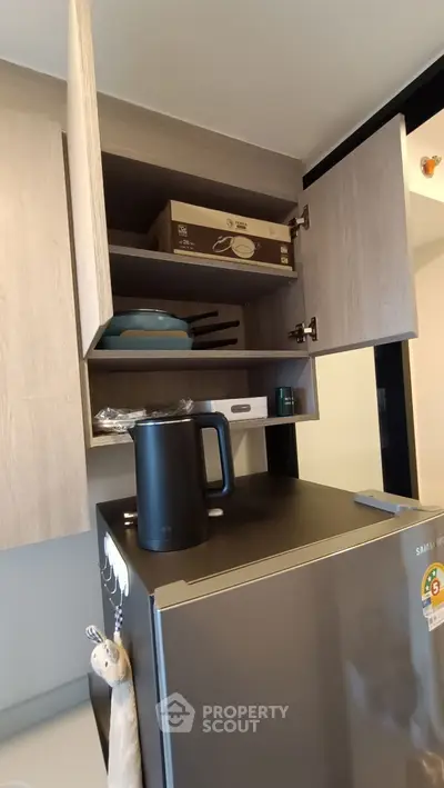 Modern kitchen with sleek appliances and ample storage space.