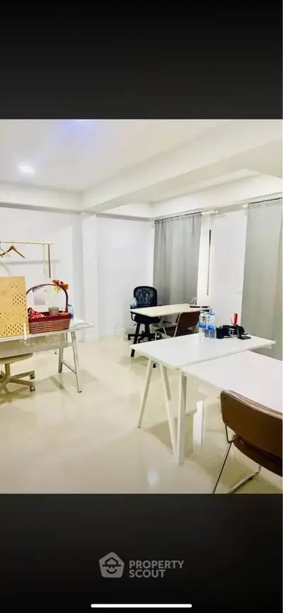 Modern office space with sleek desks and chairs, ideal for productivity and collaboration.